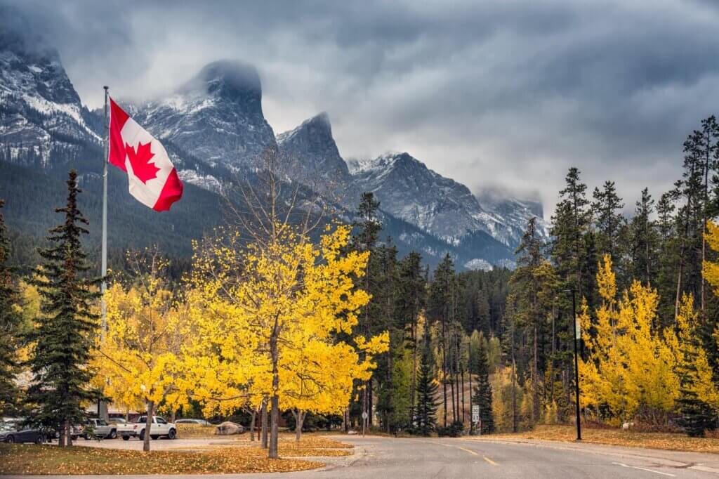 Banff National Park, Canadian flag waving above parking lot at fall time